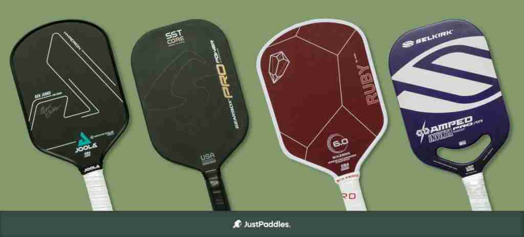 A lineup of four elongated pickleball paddles, including models from Joola, Gearbox, Six Zero, and Selkirk, showcasing premium designs and features for players seeking maximum reach and precision.
