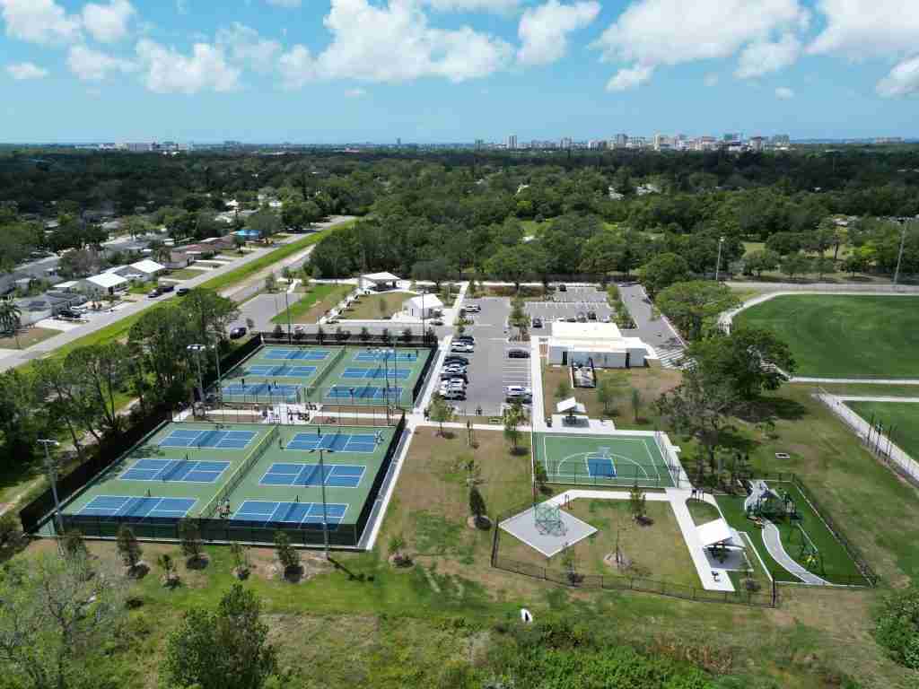 Pickleball court near me with multiple outdoor courts, parking, and recreational facilities in a vibrant community park setting.