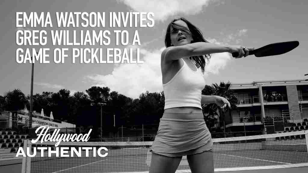 Emma Watson holding a pickleball paddle on a court.